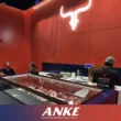 Custom-fabricated ANKE commercial meat display counter in UAE butchery showing matte black finish, argon-filled insulated glass, and per-shelf LED lighting