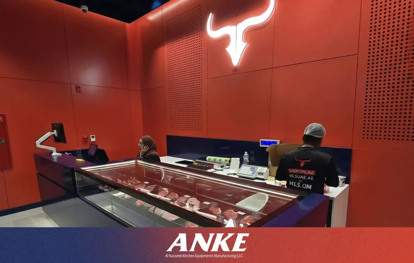 Custom-fabricated ANKE commercial meat display counter in UAE butchery showing matte black finish, argon-filled insulated glass, and per-shelf LED lighting