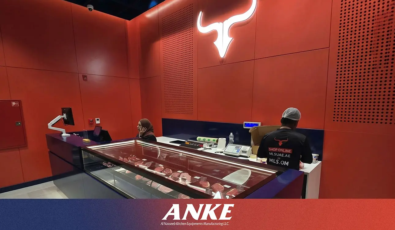 Custom-fabricated ANKE commercial meat display counter in UAE butchery showing matte black finish, argon-filled insulated glass, and per-shelf LED lighting
