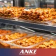 Marinated chicken kebab skewers on trays in an ANKE static-cooled refrigerated display chiller, showing intact masala coating and fresh colour.